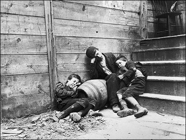 Image: Photo of street children in "sleeping quarters" taken by Jacob Riis in 1890. From the Library of Congress.