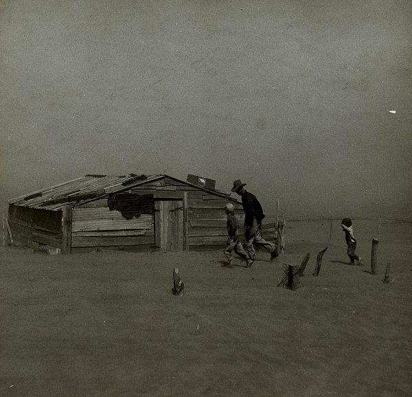 Image: Photo of Oklahoma farmer and sons walking in the face of a dust storm taken in 1936 by Arthur Rothstein. From the Library of Congress.