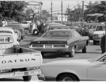 Photograph of cars at a gas station