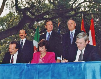 Image: Photograph taken at the NAFTA initialing ceremony in 1992. From the Wikimedia Commons.