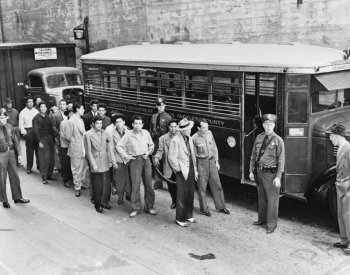 Image: Zoot suiters lined up outside Los Angeles jail after riots